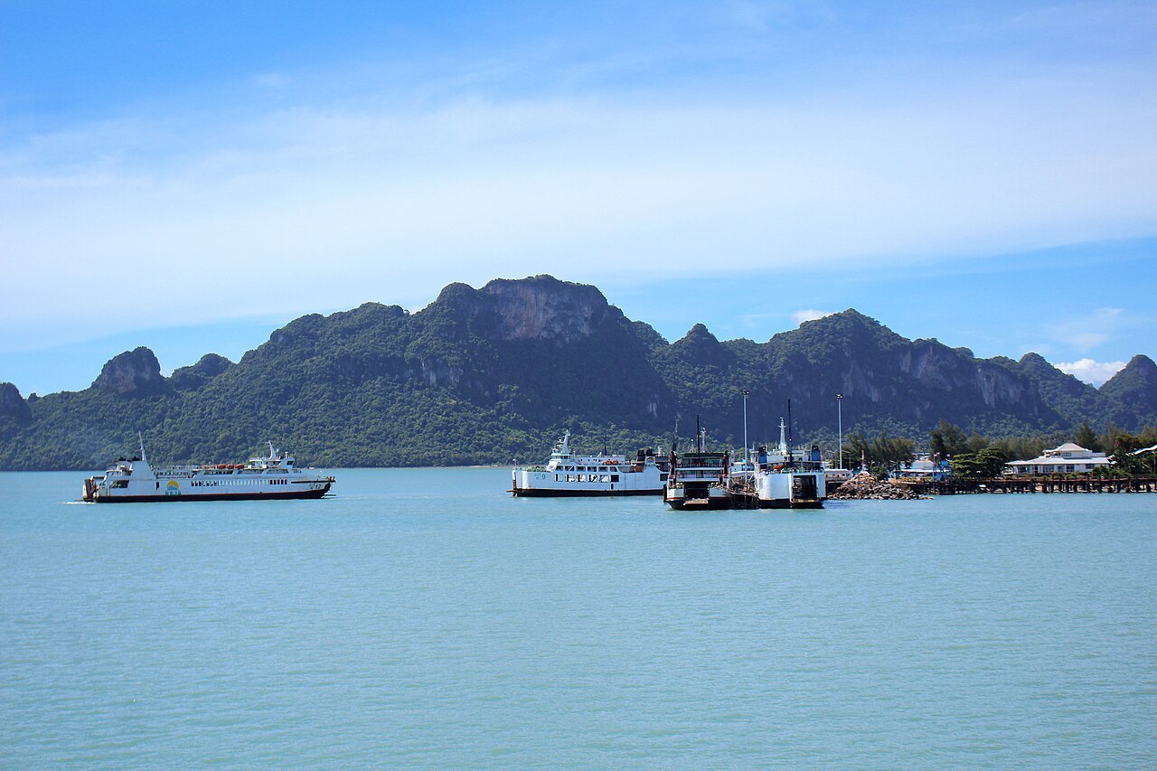 Raja ferries at Don Sak pier in Surat Thani province with limestone hills behind, the 180 baht foot passenger crossing to Koh Samui for cheap travel Thailand