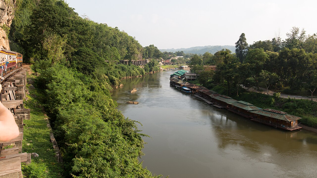 Floating bamboo raft houses moored along the River Kwai at Wang Pho near Kanchanaburi, where budget rooms cost 300 to 500 baht a night on a cheap travel Thailand itinerary