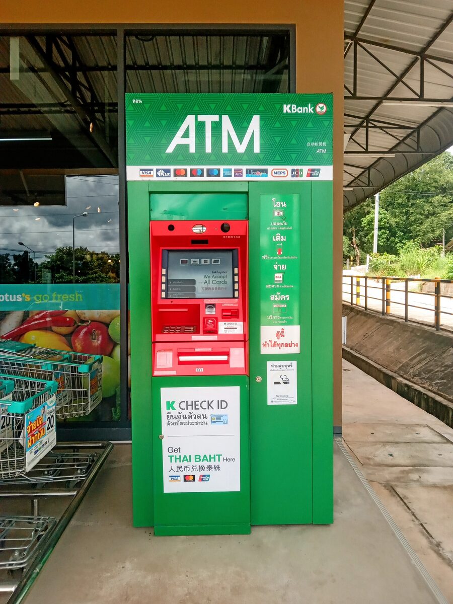 A green KBank ATM outside a Lotus's store in Thailand advertising Thai baht withdrawals, the machine that charges the 220-baht Thailand ATM fees on every foreign card