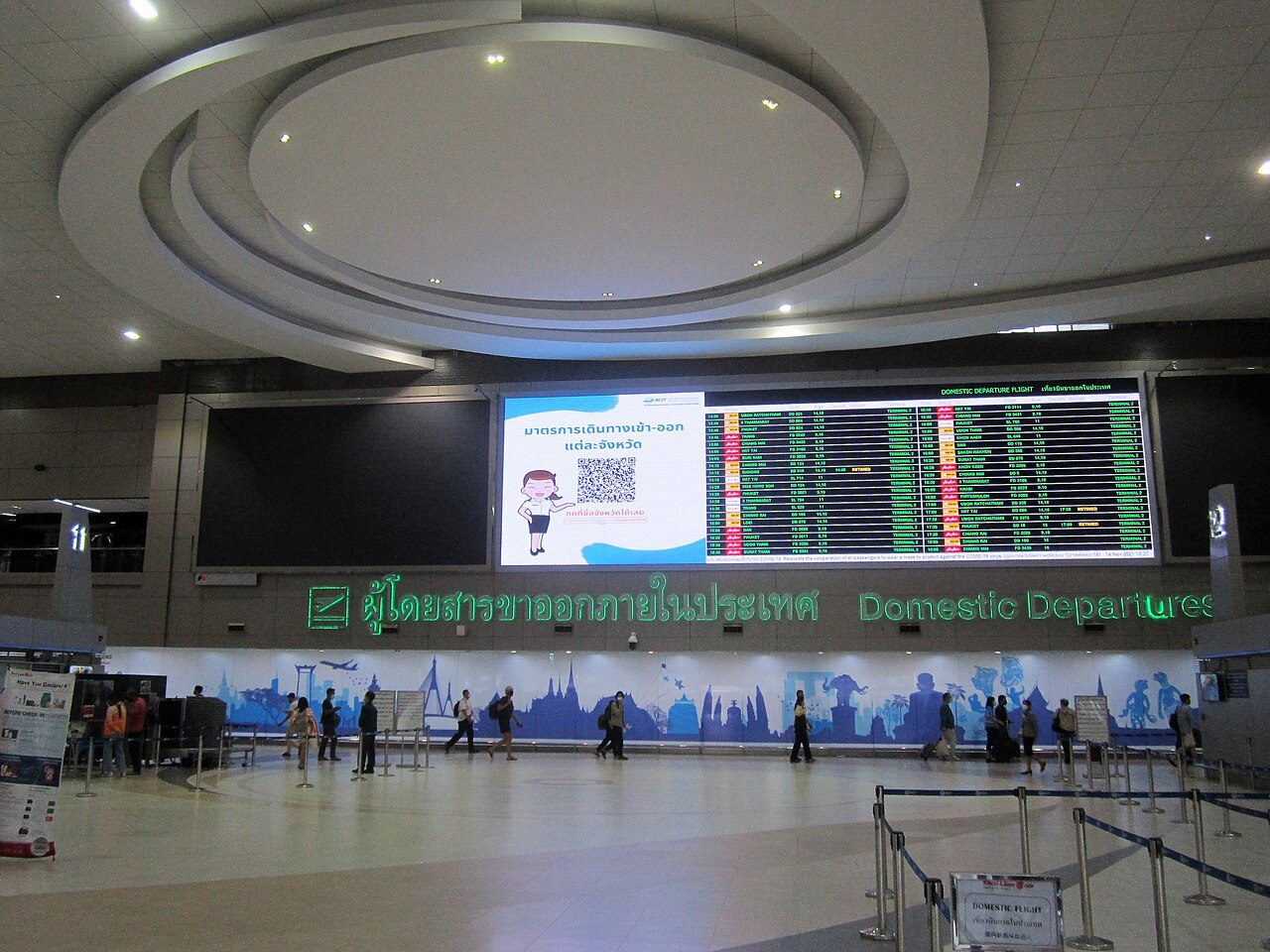 The domestic departures board at Don Mueang Airport Terminal 2 Bangkok listing FD, DD and SL low-cost flights to Chiang Mai, Phuket and Krabi, the routes covered by this Thailand budget travel guide