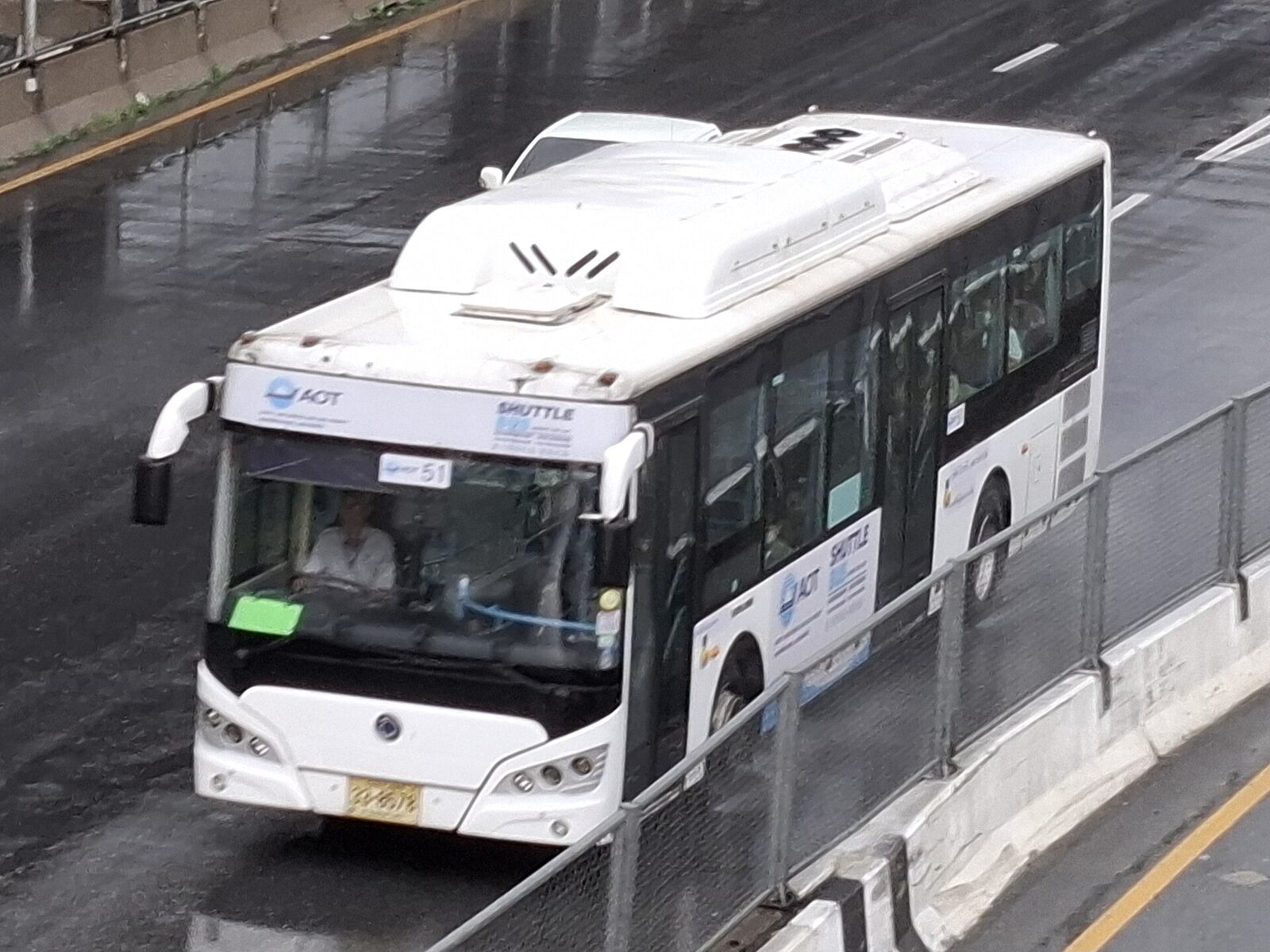 An AOT free shuttle bus running on the wet expressway between Suvarnabhumi and Don Mueang airports in Bangkok, the zero-baht Suvarnabhumi airport transit link for connecting passengers
