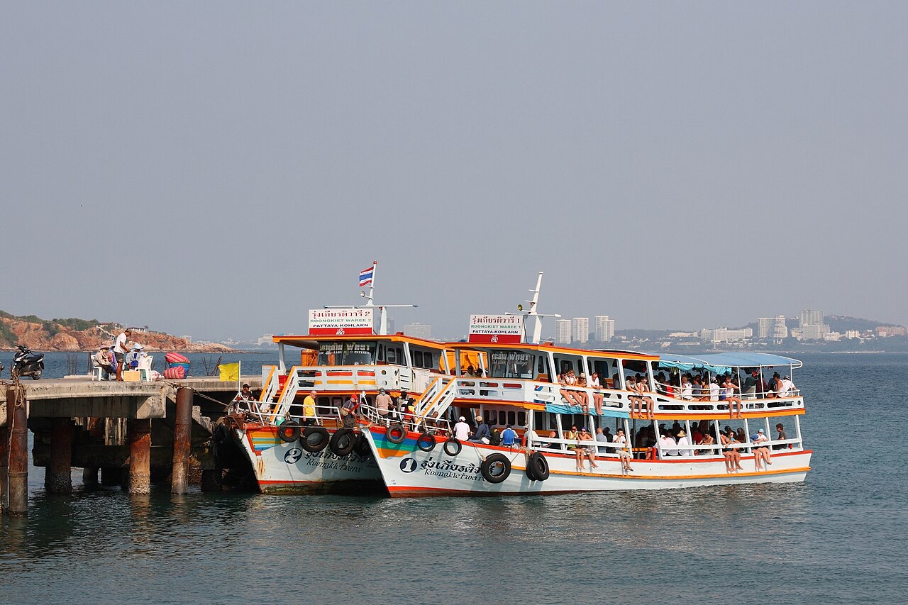 Two Pattaya to Koh Larn passenger ferries loading at Bali Hai pier in Pattaya, Thailand, the 40-baht public boats at the centre of Thailand travel costs for a Koh Larn day trip