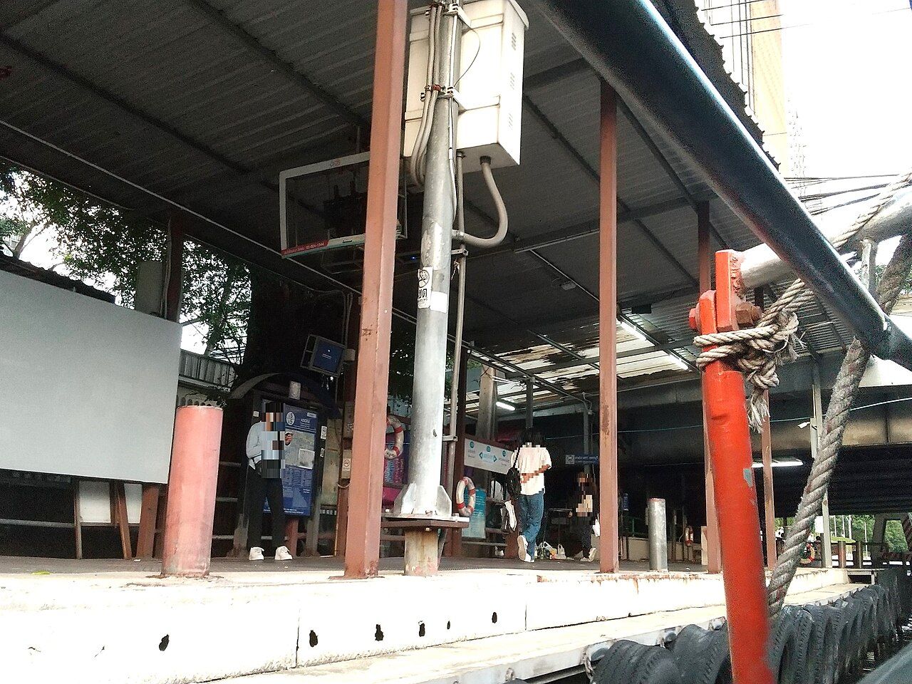 Asok Pier platform on Khlong Saen Saep in Bangkok with route board and life ring, the canal boat stop for MRT Phetchaburi used in cheap travel Thailand itineraries