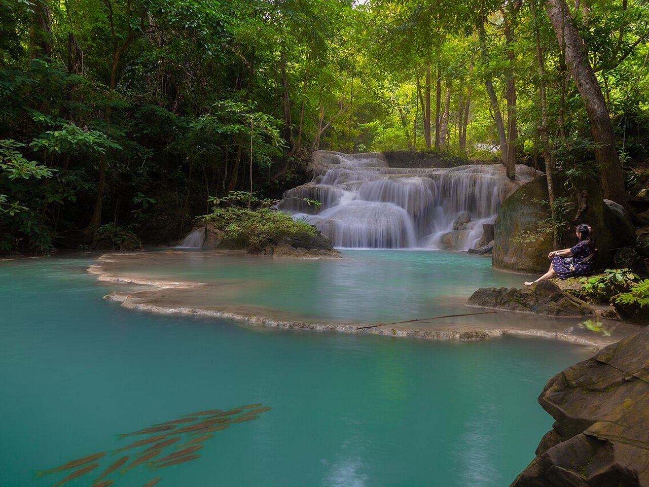 Emerald pool below the first tier of Erawan Waterfall in Erawan National Park, Kanchanaburi, a 300-baht foreigner ticket and one of the best-value Thailand travel costs